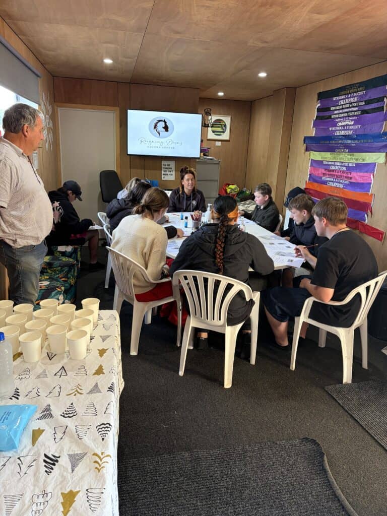 Group of young people and facilitators in a discussion at Reigning Downs Hauora Centre.